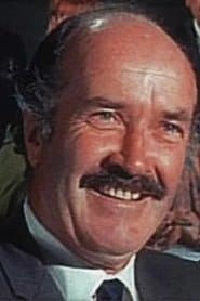 Brendan Dillon as Minister