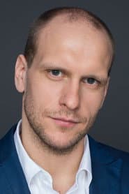 Edgar Gizatullin as security guard in the television center