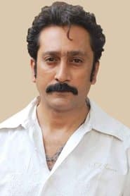 Mukesh Tiwari as Raman Dholakia