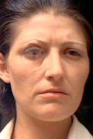 Monica Swinn as Prisoner (uncredited)