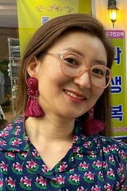 Kang Sook as Volunteer 2 from charity organization