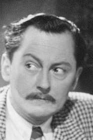 Lutz Götz as Oberlehrer Dr. Brett