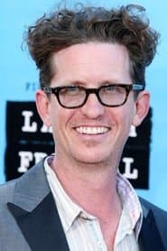 Kieran Mulroney as Gil Kinney