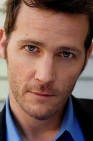 Graham Abbey as Coach Matthews