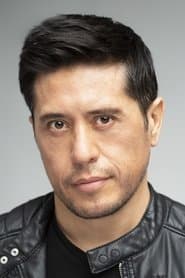 Eddie Martinez as Coach E