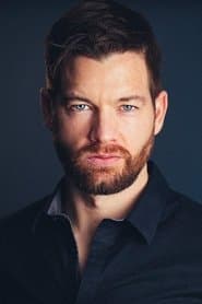 John Palladino as John Williams