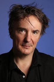 Dylan Moran as Tom Quirk