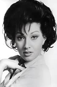 Helga Liné as Sara, Mann's Assistant