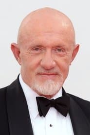 Jonathan Banks as Milos Drubnik