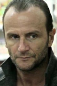 Xavier Alcan as John Baccardi