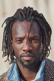 Ibrahima Ba as Patron Barbershop