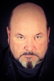 Sion Tudor Owen as Caronte