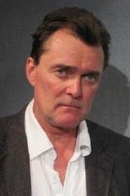 Stuart Milligan as Greenfield
