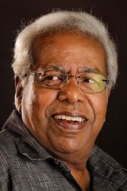 Thilakan as Sridharan Menon