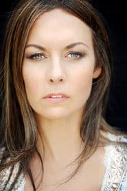 Camme Tyla as News Reporter