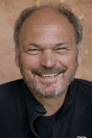 Georg Feils as Genie of the Lamp (voice)