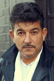 John Altman as George Harrison