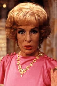 Yootha Joyce as Mrs. Palafox