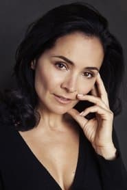 Sarah Edmondson as Trish Britton (Reporter)