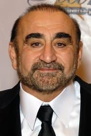Ken Davitian as Father Salinas
