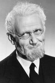 Ludwig Donath as Dr. Heinrich von Kronen