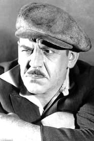 Pat Harmon as The Football Coach