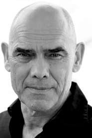 Peter Guinness as Priest