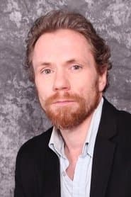 Travis MacDonald as Hitcher