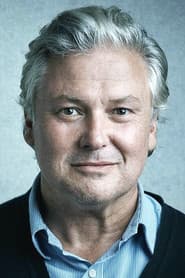 Conleth Hill as Bernard Sugden