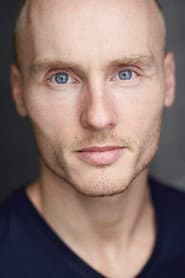 Zak Rowlands as Baldini