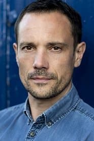 Duncan Pow as Ruescott Melshi (archive footage) (uncredited)