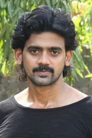 Rajaji Manickam as Vellaisami (white)
