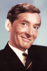 Kenneth Williams as Agent Desmond Simpkins