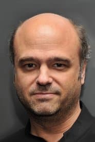 Scott Adsit as Archie MacIntosh