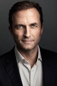 Stephen Hogan as Ambassador Cahill