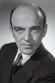 Herbert Berghof as Prime Minister Andreas Ordy