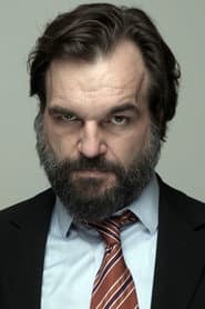 Sébastien Deleau as Kiosk owner