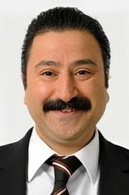 Metin Yıldırım as Grocer