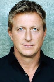 William Zabka as Greg Larsen