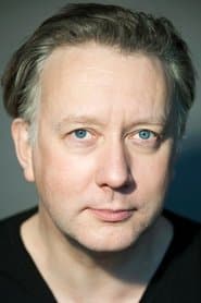 Jasper Britton as The Host